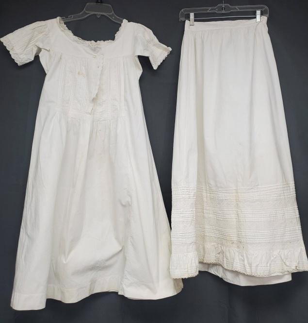 Edwardian White Dress and Skirt: Edwardian white small dress or night gown with pintucks and hand embroidery along with a white petticoat or skirt, also with pintucks and lace. Both are in good condition with spots and storage discol