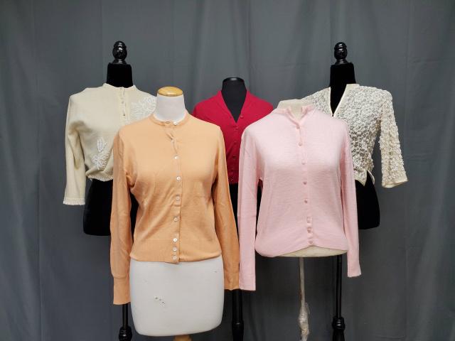 6 Vintage 1950s Ladies Sweaters: 5 Vintage 1950s Ladies Sweaters includes a pink Hi Bulk Super Orlon Belle Knit sweater in very good condition. A peach Pure Cashmere, Bernard Altman Made in Austria sweater in fair condition, small mo
