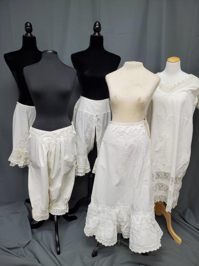 5 Edwardian Whites - Bloomers: 5 antique Edwardian whites includes 3 pairs of bloomers or pantaloons, 2 are split crotch and ties in front, the other pair ties on the sides. Also included is a long white petticoat with pintucks and