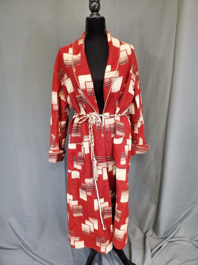 Vintage Beacon Robe: Vintage Beacon robe, brown with geometric motifs, brown and white gimp pipe edging and belt, belt is coming untwisted. Measures 48 inches long, 18 inches across the shoulders and 23 inch long sleeves.