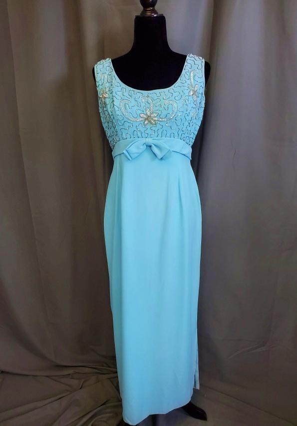 Vintage Aqua Maxi Dress with Beaded Bodice: Vintage aqua maxi dress in a crepe material with silver beads and iridescent sequins, empire waist with an embellished bow, metal back zipper, no tags, measurements laying flat: 19 inch bust, 15 inch 