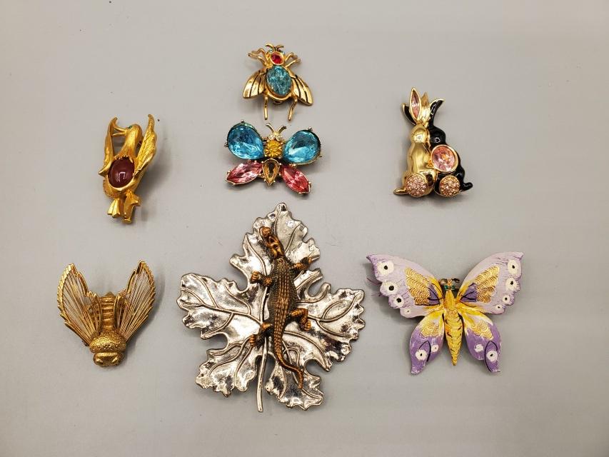 7 Vintage Pins - Bugs and Animals: 7 vintage pins including a gold tone duck with brown stone and rhinestone eye 1.75", marked Paris, very good condition. A gold toned bee marked Monet, 1.5", very good condition. Hand painted butterfly