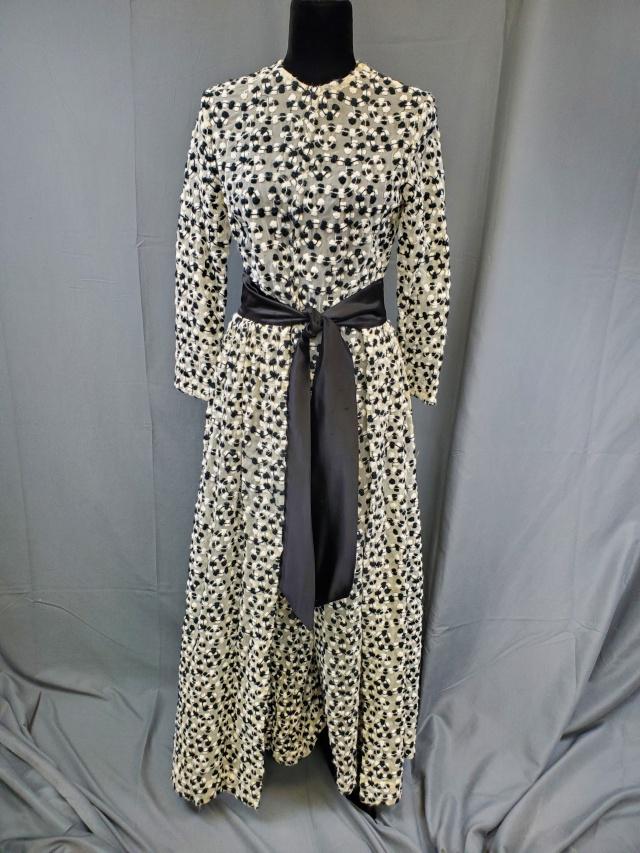 Vintage Jumpsuit with Wrap Around Skirt: Vintage sheer wide leg jumpsuit with wraparound skirt, very sheer with wool fiber machine embroidery all over, back zipper. Wraparound skirt ties in the front. No tags, may be homemade. Measures 36 in