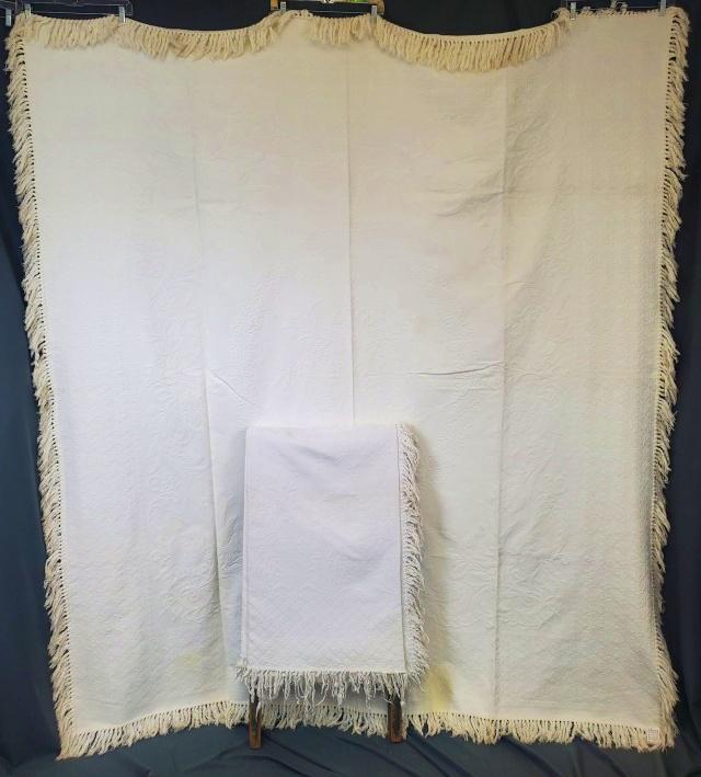 2 Vintage Matelasse Bedspreads Lilies and Jonquils: 2 Vintage c1940s matelasse bedspreads with fringe. Spread #1 is a medallion style with Lilies in the center in a leaf frame, with an inner border of more lilies, flowers, and leaves, and a small overa