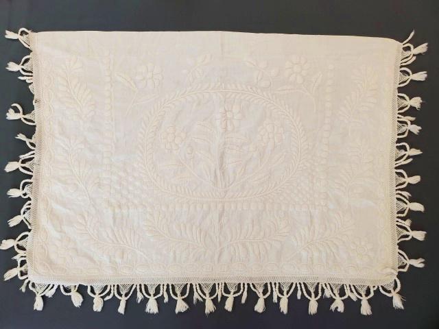 Antique Trapunto Pillow Layover: Antique Trapunto Pillow Layover with flowers, feather leaves and a chain border. It measures 28x39 inches with an additional 3 inch fringe on 3 sides. In very good condition, with 2 small spots. This 