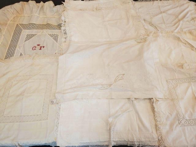 Group of Vintage Pillow Layovers and Shams: Group of vintage pillow layovers and shams including a single sham with red cross stitched initials, a single layover with cutwork and embroidery, 3 pairs of shams with lace edge, and 3 additional sin