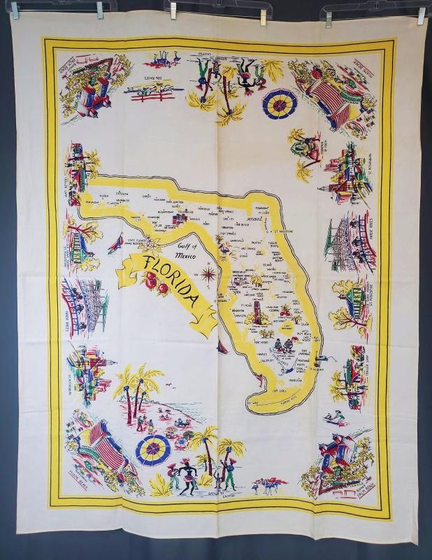 Vintage Printed Florida Tablecloth - Yellow: Vintage printed souvenir tablecloth from Florida, measuring 52x66 inches. Feels like cotton. In good condition with some small spots and storage discoloration. This item was part of Laura Fisher's est