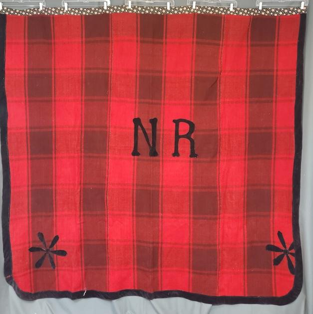 Vintage Wool Plaid Monogrammed Blanket: Vintage red plaid wool blanket measuring 86 x 84 inches with machine appliqued black velvet "N R" monogram in the center and two flowers along the bottom at each corner. Velvet edge on three sides and