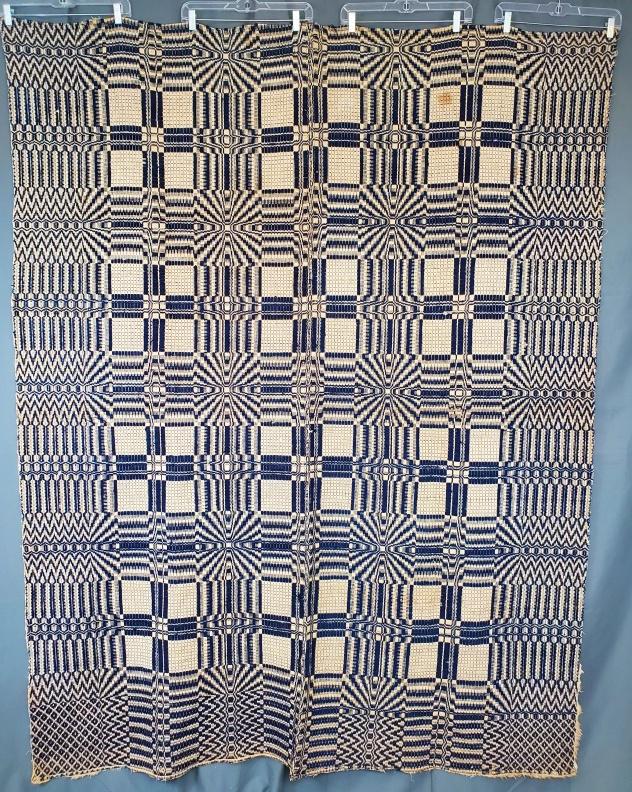 Antique Geometric Double Weave Coverlet: Antique Geometric Double Weave Coverlet measuring 64x81 inches. Hand stitched seam down the center. In fair condition, missing fringe, large spots, and some wear. We do our best to describe all items 