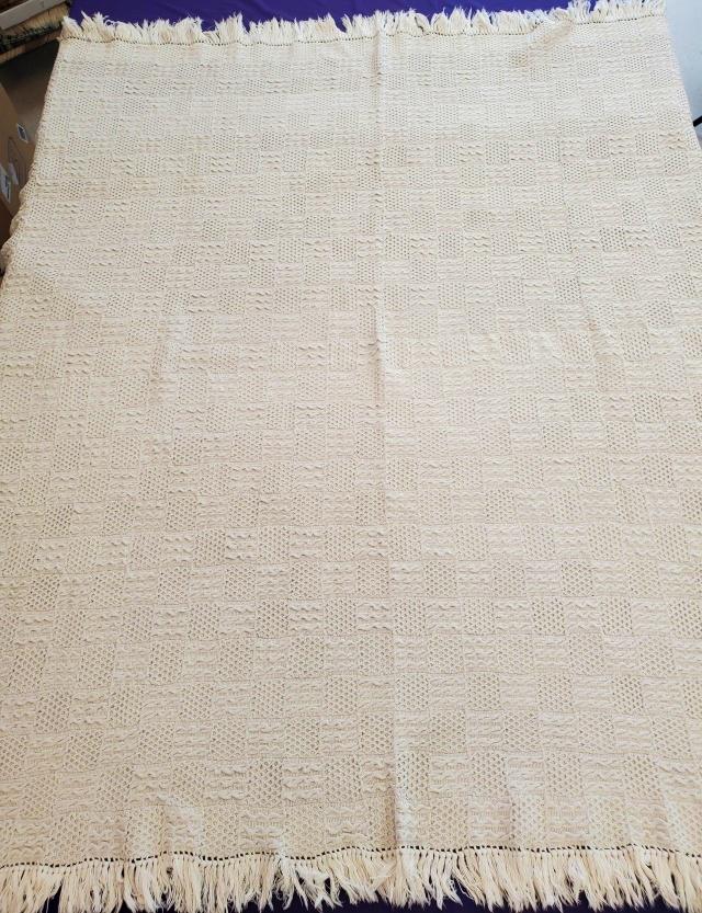 Vintage White Knit Blanket with Cable and Lattice: Vintage white knit blanket measuring 68x71 inches with 3 inch fringe on all 4 sides. Alternating squares with dimensional cable motifs and lattice motives. Very heavy, cotton. In very good condition. 