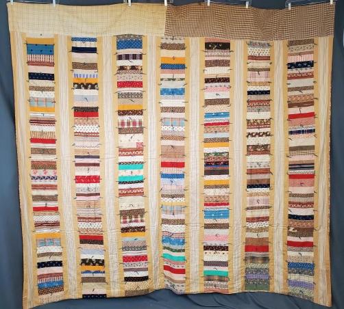 Antique Roman Stripe Comfort Quilt c1880: Antique Roman Stripe Comfort Quilt c1880 measuring 95x86 inches. 7 bars are 7.25 inches wide with a variety of prints from 1860s-1880s. The plaid fabrics across the border may be a conservation effort