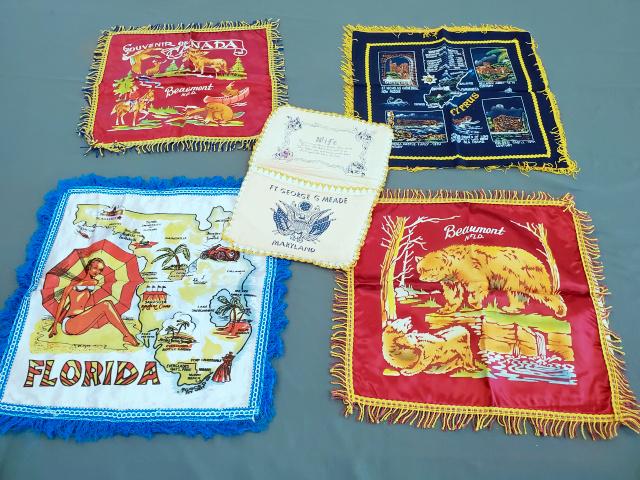 4 Vintage Souvenir Pillow Covers and Lingerie Bag: 4 Vintage Satin Souvenir Pillow Covers from Florida, Cyprus and a pair from Beaumont Newfoundland, all in very good condition and Lingerie Bag from Fort George G Meade in Maryland for a serviceman's w