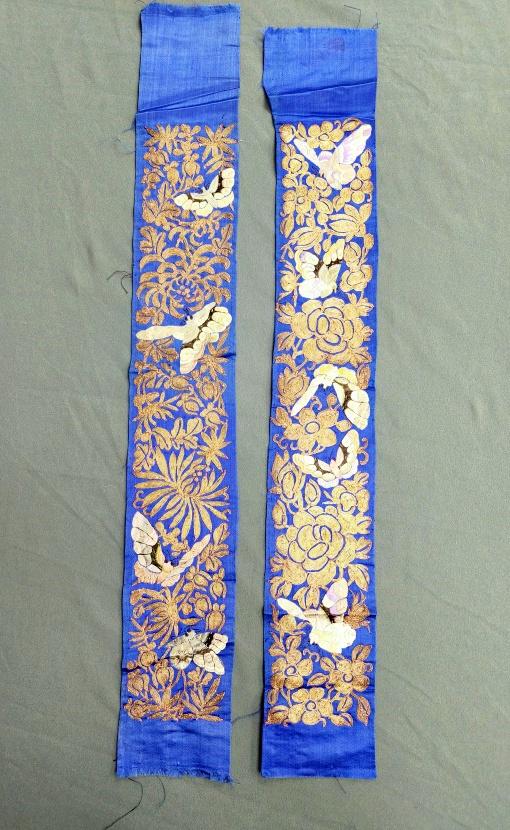 Pair of Chinese Embroidered Silk Sleeve Bands - Butterflies: Pair of antique Chinese sleeve bands, blue silk with embroidery and couched metallic threads depicting butterflies. Measures approximately 3.25 x 23.5 inches each. In good condition with minor spots t