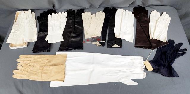 12 Pairs of Vintage Ladies Gloves: 12 pairs of vintage ladies gloves including one pair of white sueded fabric elbow length gloves in fair condition with some spots and missing buttons; one pair of navy blue knitted sheer gloves with r