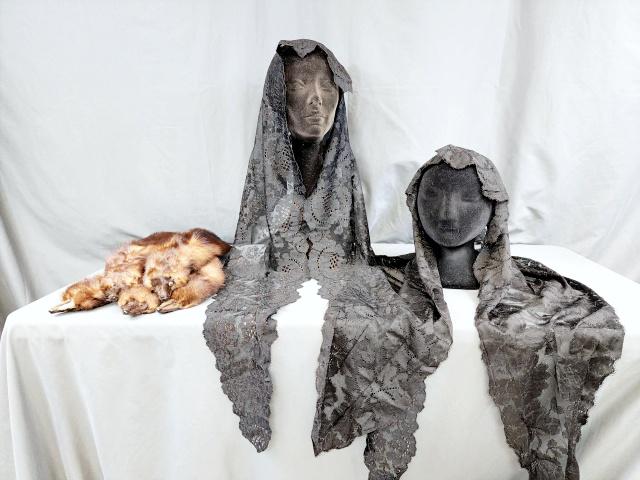 2 Vintage Black Lace Mantillas & Minks: Two vintage machine made black lace mantillas, first mantilla measures 20 inches at its widest point and 84 inches long; second measures 28 inches at its widest point and 68 inches long. Both in very 