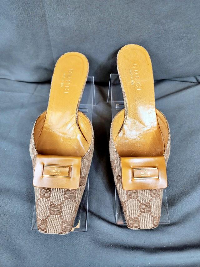 Gucci Arielle Mules Size 6 Shoes: Gucci Arielle mules, with Gucci signature fabric and light brown leather, with Gucci Made in Italy of front, marked size 6 B, wood heel, in good used condition with wear to the heels, measures about 1