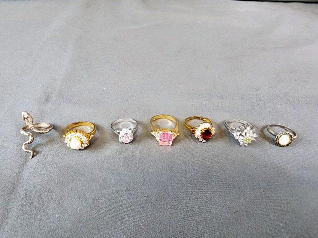 7 Rings - Marked Sterling, 925, 18k SE: 7 rings, all marked either Sterling or 925, BUT I found some are magnetic. Please read the complete description. Snake ring, 3.53 grams, size 4.5 but adjustable, marked 925, NOT magnetic. Opal stone, 