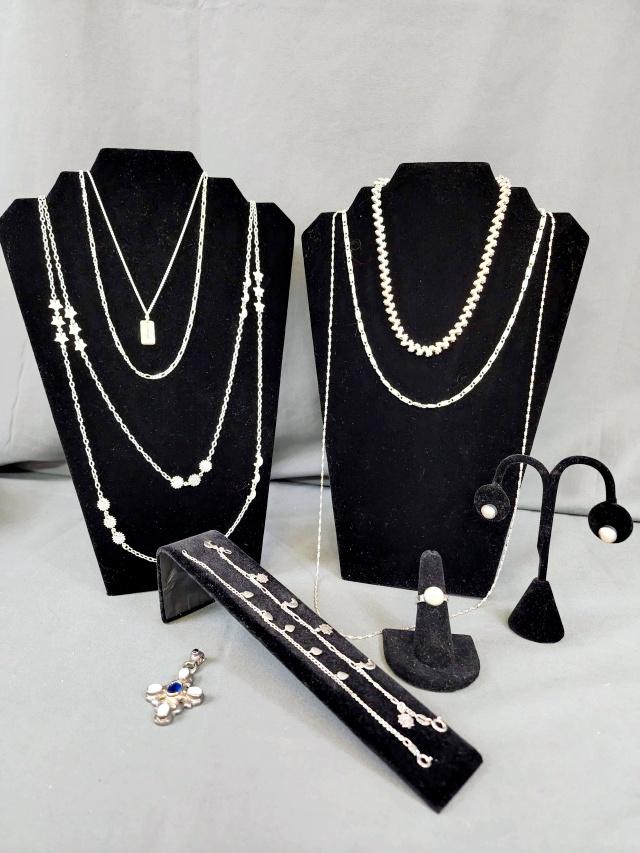 Group of 925 Silver Jewelry - Mostly Chains: Group of silver 925 jewelry, all marked and NOT magnetic. Includes a heavy serpentine like chain, 16", 20.25 grams, marked 925 on clasp. An S link chain, 20", 15 grams, marked Canada 925. a diamond cu