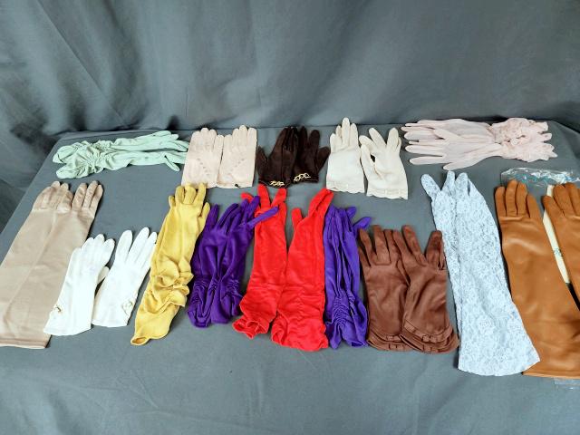 Group of 14 Vintage Ladies Fabric Gloves: Group of 14 pairs of vintage ladies gloves in fabric including several pair that are ruched up the sides: 2 in purple (Gloves of Meyers Make, Size 7, nylon), one in red, one yellow, one mint green, an