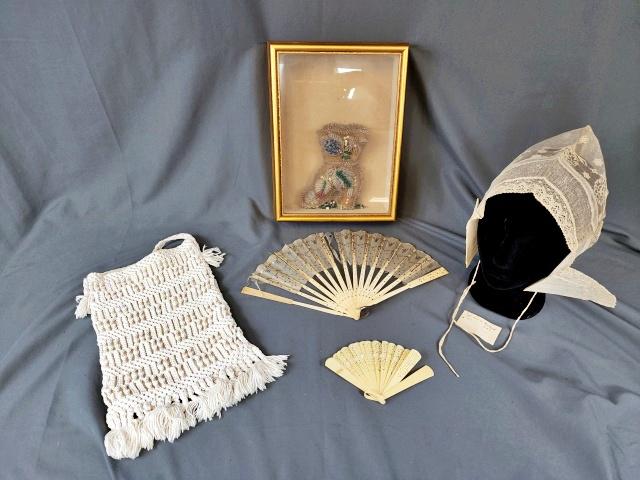 Antique Group Fans, Dutch Bonnet, Pin Cushion: Group includes 3 antique fans, 2 are in poor condition with splits in the fabric, and detached blades, one is in very good condition. A lace bonnet with a note attached that it was acquired in Holland