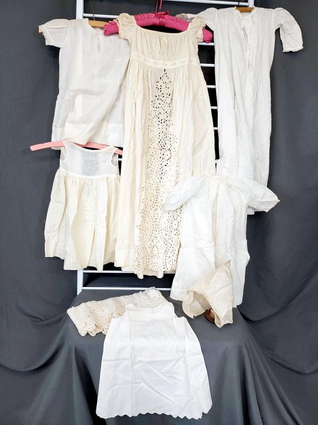 Antique Baby Dresses with Quaker Provenance: 4 Antique Baby Dresses, 2 baby slips, a bonnet and extra hand embroidered trim. Includes provenance from a family believed to be Quakers. Please see lots 125 and 126 for additional documentation. Al d