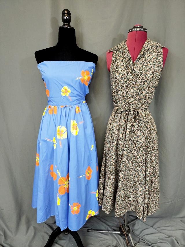 2 Vintage Summer Dresses: Group includes a vintage floral print rayon blend summer dress with buttons down the front to the waist, an elastic waist, and ties in the front, size teen 9/10. In very good condition. Along with a b