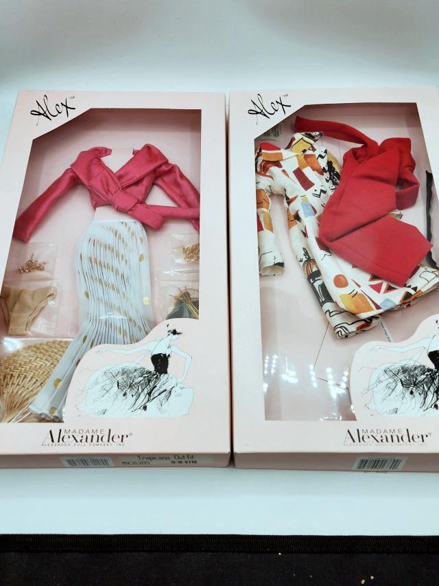 2 Madame Alexander Alex Outfits in Boxes D: 2 Madame Alexander Alex Outfits in Boxes Group D includes City Sights Outfit and Tropicana (never opened). These doll items have been gently played with, redressed, and displayed behind glass in a smo
