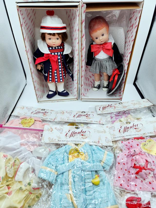 2 Effanbee Patsy Dolls and Many Outfits: Group includes Effanbee Patsy Anchor's Aweigh PA1304 and Picture Perfect PA1302 Dolls in their original boxes with shippers. Also includes 5 outfits, never removed from packaging Powder Puff PA8301, M