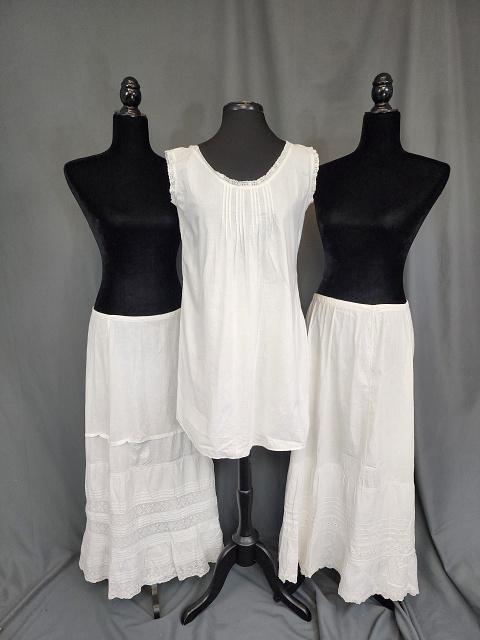 3 Edwardian Whites: 3 Edwardian Whites. Includes a long chamise with eyelets along the neck and armholes, measures 21" bust x 31" long, in good condition with small spots on a shoulder; along with 2 long petticoats or un