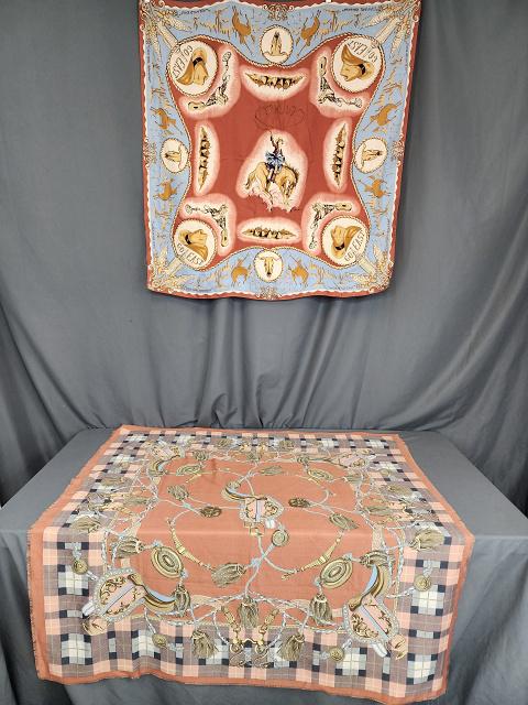 2 Equestrian Themed Scarves - DKNY Cowgirl: 2 Equestrian Themed Scarves. Includes DKNY Go East silk scarf measuring 38" by 39", hand rolled hem, from 1992, with cowgirls, hats, boots and other Western themes. Along with a pink, blue an beige wo