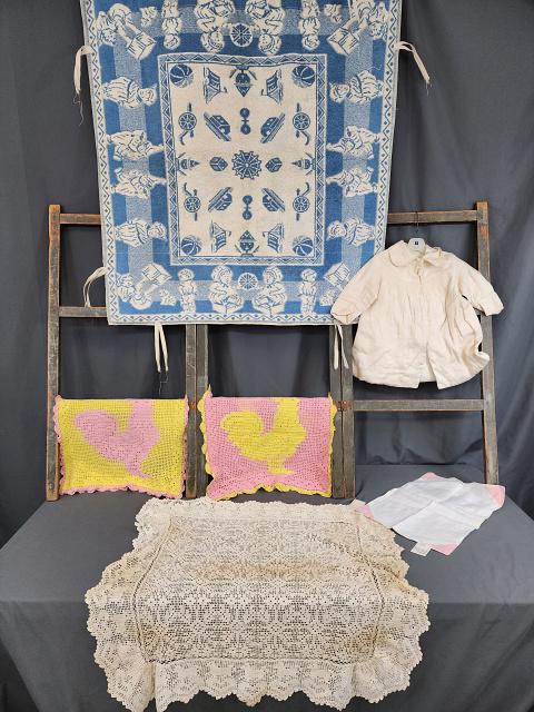 Group of Child's Textiles: Group of Child's Textiles. Includes what is believed to be a playpen mat with children playing in the border and toys in the center field, in fair condition with spots and some wear; also includes a s