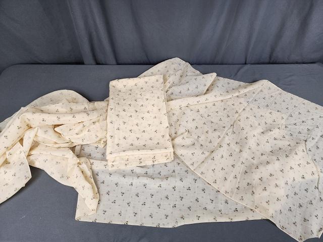 Antique Fine Wool Floral Print Fabric - 8 yds: Antique fine wool fabric in a pale yellow with springs of dainty flowers measuring 21.5 inches wide (selvedge width) by 5 yards, with an additional piece made into a curtain panel, measuring 34x62 inc