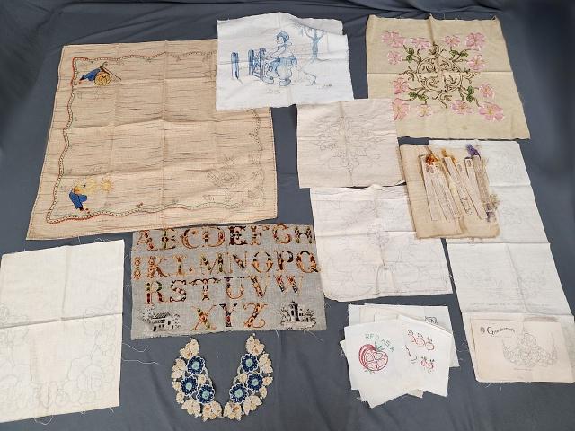 Vintage Embroidery Linens to Finish and more: Group of vintage linens to be embroidered, some have been finished, others were started but incomplete, and others are the printed linen. Included is a blue work tinted cotton pillow cover, unfinished