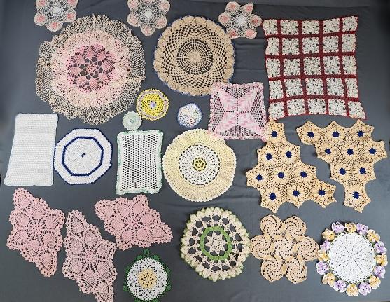 23 Vintage Colorful Crochet Doilies: 23 vintage colorful doilies in a variety of shapes and colors including stars, tulips, pansies, and a few dimensional. Condition is good to very good with some storage discoloration, spots and a few b
