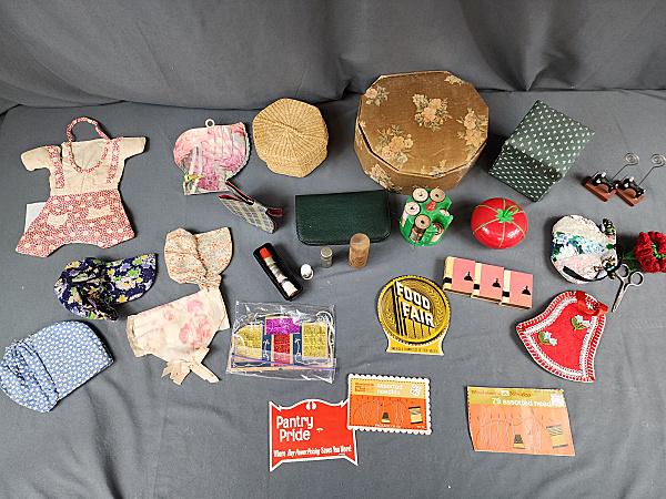 Lot of Sewing Boxes, Needle Cases & Notions: Lot of sewing boxes, needle cases and notions. Includes 5 needle books, some used; 3 small boxes of thread; a small wicker basket with contents; 1980s Singer sewing box with contents; a little plastic
