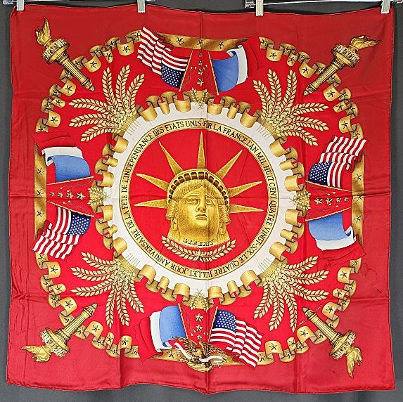 Vintage Hermes Paris Statue of Liberty Silk Scarf by Metz: Vintage Hermes Paris Statue of Liberty Silk Scarf by Metz. Red silk Statue of Liberty scarf designed by Joachim Metz c1980s, measures approximately 35" x 35", hand rolled hem. In fair condition with s