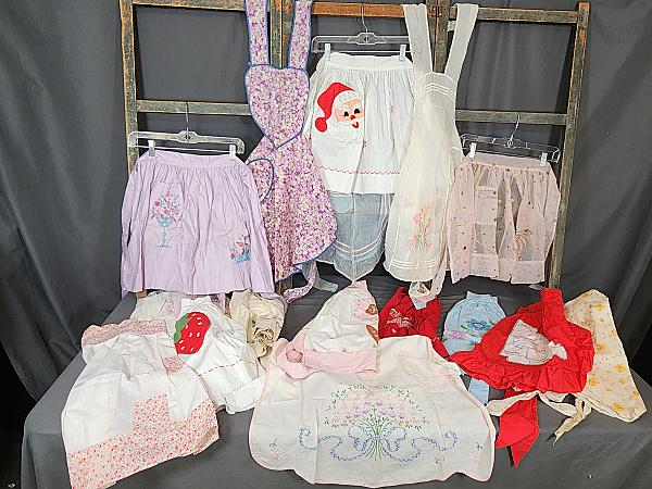 Vintage Collection 17 Aprons - Christmas, Feedsack: Vintage collection of 17 aprons, mostly half aprons, but a few full aprons. Include Christmas, feedsack, hand embroidered, cross stitch, applique, tea aprons, and more. They are in fair to good condit