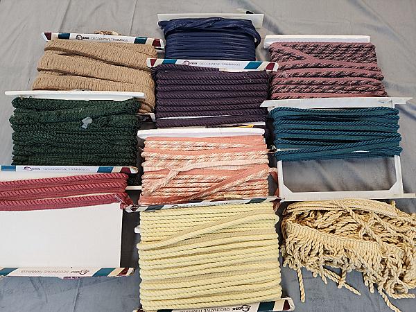 10 Bolts of Decorative Trim - Group 2: 9 Bolts plus one loose of Decorative trim, from 1 yard pcs to several yards. There are gimps, braids, fringe, and more. By Consol and Hollywood. Many of these originally sold for $8/yard! In overall g