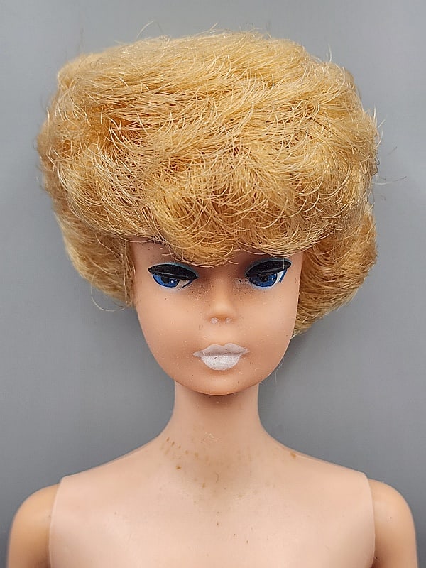 Vintage Barbie - Bubblecut Blonde Nude: Vintage Barbie-Bubblecut Blonde, S/L, Nude. She has marks on her arms and legs with minor tackiness. No box, no shoes no earrings, no paperwork. We do our best to describe all items in detail and prov
