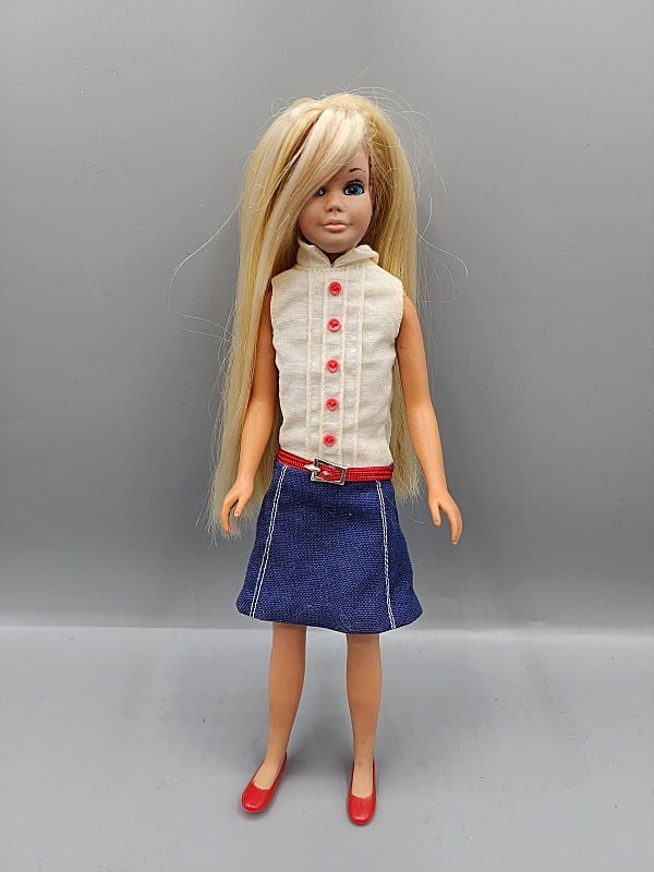 Vintage Malibu Skipper - Rerotted Blonde: Vintage Malibu Skipper, S/L, has rerooted hair in different shades of Blonde. She is wearing her jumper with blue skirt and white top and has red shoes. She is in good condition with minor marks on he