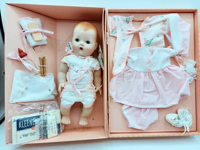 Porcelain Tiny Tears Doll in Suitcase: Porcelain Tiny Tears Doll in Suitcase, a reproduction by Ashton Drake. Appears never to have been removed from her box. Has sleepy eyes. Appears to be complete. We do our best to describe all items in