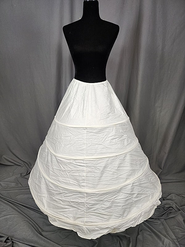 Antique Wire Framed Hoop Skirt - E: Antique Wire Framed Hoop Skirt - E. Consists of 4 plastic tiers; fabric is white cotton, machine constructed. Drawstring waist. In very good condition with , minor discolorations. Tag: Hoops! My Dear,