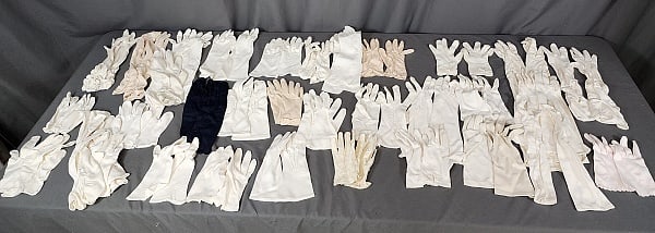 Large Group of Vintage Gloves: 30 pairs and 6 single vintage gloves. All fabric but one pair. One navy pair, the rest are a mix of white, off white, and beige. Embellishments include beading, ruching, embroidery and eyelets. Appear