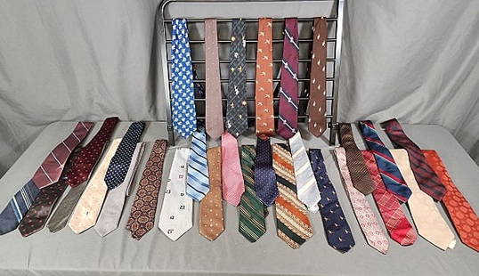 31 Vintage Mens Silk Ties - YSL, Dior, more: 31 Vintage Men's Silk Ties, many with brocade or woven figures like birds, cats, polo player. There is also a Warner Brothers Tie with Bugs Bunny, Donald Duck, Tweety and Taz. Some MCM designs. Design