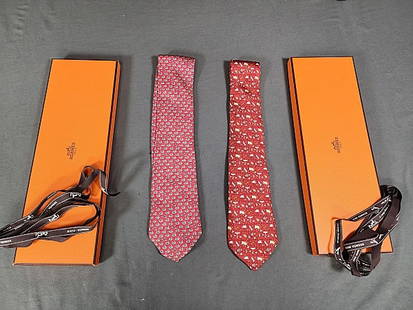 2 Mens Hermes Ties with Boxes: 2 Men's Hermes Silk Ties in Hermes Boxes with ribbon ties included. Both are novelty, one is red with tiny ducks, the other is reddish brown with ballons, rocket ships, moon, sun, weather, and stars.