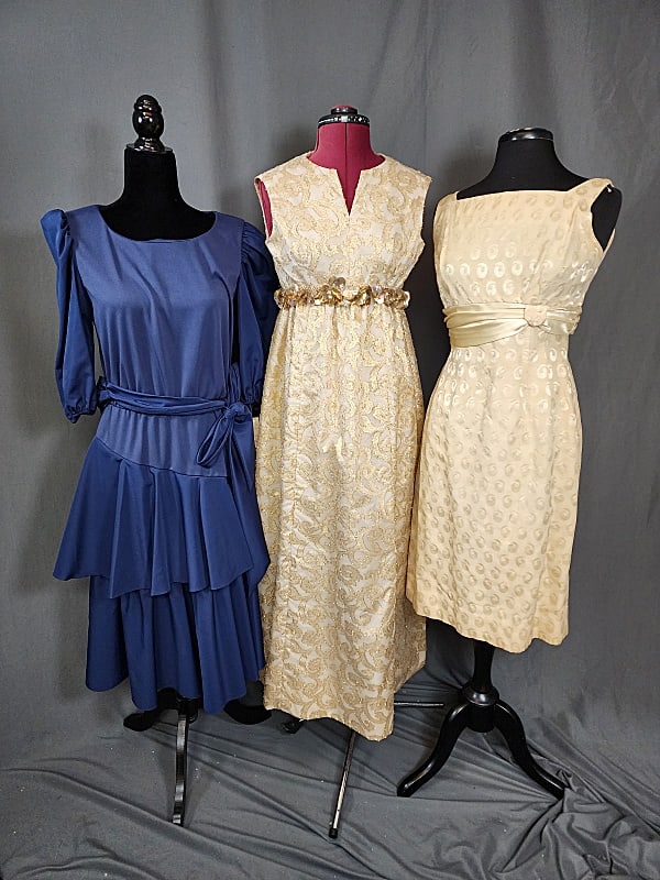 3 Vintage Dresses: 3 Vintage Dresses. A pale yellow damask sheath style dress with a pleated satin belt that ties in the back. Metal back zipper. Appears to be home made. Measures flat 17 Bust, 15 Waist, 17 Hips. Scatte