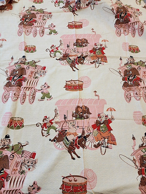 Vintage MCM Circus Themed Fabric: Vintage MCM Circus Themed Fabric. 2 pieces both 43'' wide, one measures 1.5 yards and the other is just under an inch. Off white, pink, and brown home decor weight fabric with texture. In good conditi