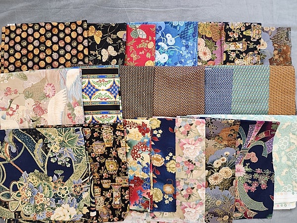 8lbs of Quilt Fabric- Asian Theme: 8lbs of Quilt Fabric- Asian Theme. Group includes 22 different Asian themed cotton quilters fabrics. Several with metallic printing. Designs by Oriental Gardens by Artistic Expressions, Michael Miller