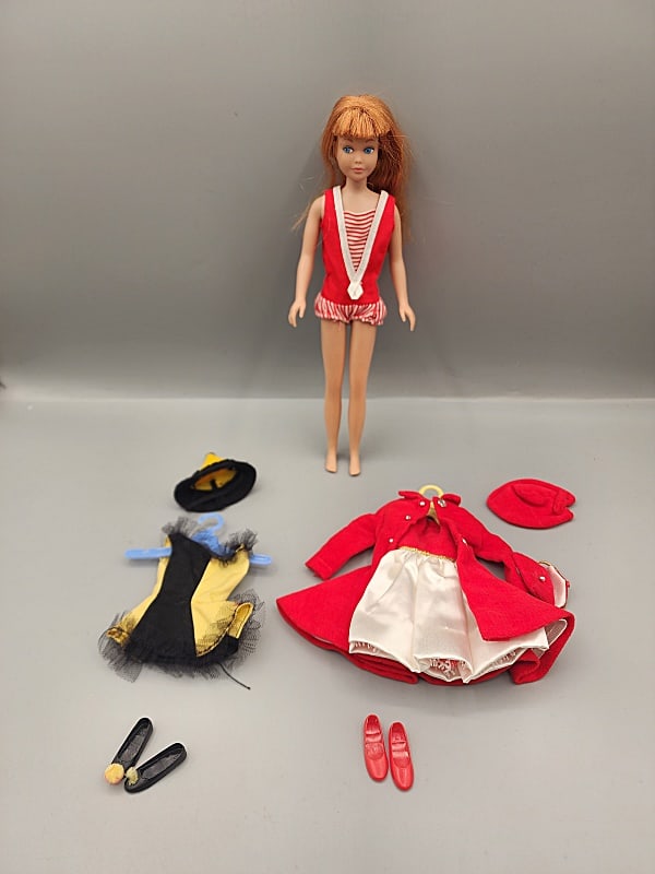Vintage 1963 Redhead Skipper With Clothing: Vintage 1963 Redhead Skipper With Clothing in her original outfit also includes red velvet coat with matching dress and hat, a black and yellow short costume dress with hat & shoes, and a red pair of