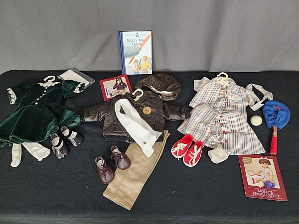 3 American Girl Molly Outfits: 3 American Girl Molly Outfits, all retired/discontinued. Includes Green Velvet Holiday Dress with stocking, black shoes and hair ribbon,. Special Edition AViator Outfit with Jacket, helmet, silk scarf